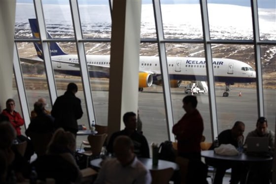An Icelandair airplane sits on the tarmac as travelers wait for a flight inside the Akureyi Airport on Saturday in Akureyi, Iceland.